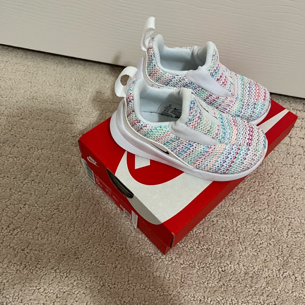 Nike toddler sneaker size 5c white with multi color detail gently used